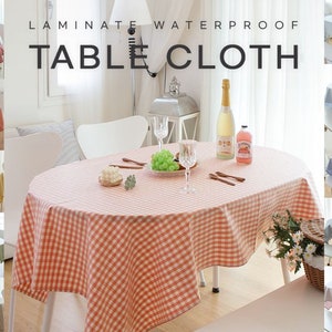 May include: A set of 10 oval-shaped tablecloths with a red and white checkered pattern. The tablecloths are made of laminated waterproof fabric. The text "Laminate Waterproof Tablecloth" is displayed at the top of the image.