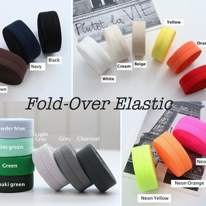 Peut inclure: Assortiment d'élastique à rabat dans différentes couleurs, notamment marron, noir, marine, blanc, crème, beige, jaune, orange, rouge, bleu poudre, gris clair, gris, anthracite, vert menthe, vert, vert kaki, rose fluo, orange fluo et jaune fluo.