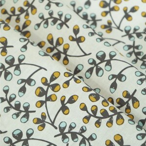 May include: White fabric with a repeating pattern of small brown branches with blue and yellow leaves.