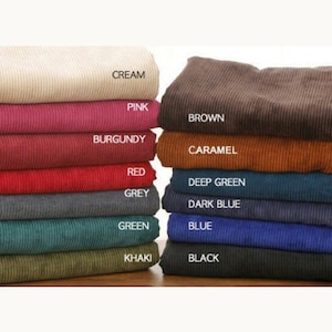 May include: A stack of 12 corduroy fabric swatches in various colors, including cream, pink, burgundy, red, grey, green, khaki, brown, caramel, deep green, dark blue, blue, and black.