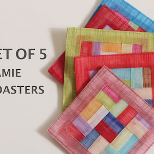 May include: A set of five square ramie coasters featuring a patchwork design with various colors including red, green, blue, and pink. The coasters are layered on top of each other. The text SET OF 5 RAMIE COASTERS is printed on the left side.