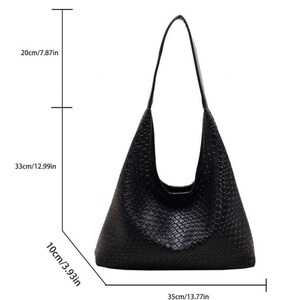 May include: Black woven leather handbag with a single strap. The bag measures 35cm wide, 33cm tall, and 10cm deep.