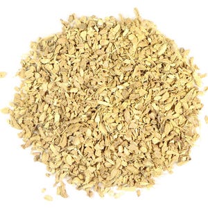 May include: A close-up shot of a pile of dried ginger pieces. The ginger is a light brown colour and has a fibrous texture. The pieces are irregularly shaped and vary in size, with some small fragments and larger chunks.