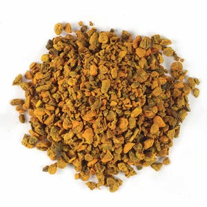 May include: A close-up shot of a pile of dried, chopped turmeric root. The pieces vary in size and shape, displaying a mix of orange and brown hues. The image is set against a plain white background, highlighting the texture and color of the spice.