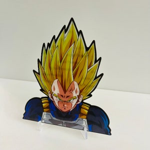 May include: A yellow-haired anime character with a serious expression, wearing a blue and black suit. The character is a popular figure in Japanese pop culture.