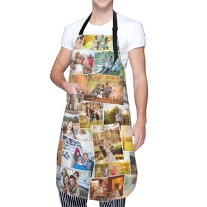 May include: A personalized kitchen apron with a collage of family photos printed on it. The apron is white with black straps and a large pocket on the front. The photos are arranged in a random pattern and show a variety of people and activities.