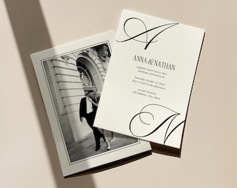 May include: Two wedding invitations. One features a black and white photo of a couple. The other has the names "ANNA & NATHAN" in black script, along with event details. The background is a light beige.