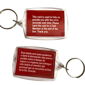 May include: Two clear plastic keychains with a red rectangular insert. One keychain has English text: "This card is used to help us provide you with the most accurate wait time..." The other has Spanish text.