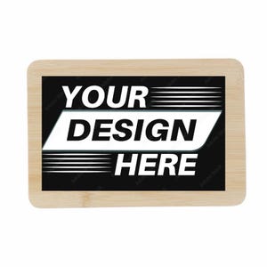 May include: A rectangular wooden sign with rounded corners. The center features a black background with the words "YOUR DESIGN HERE" in white, with a white and gray angled design element.