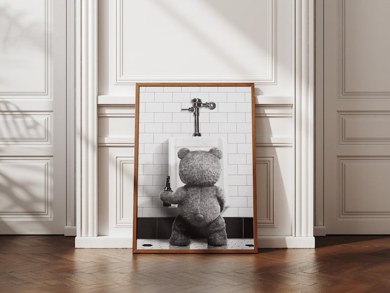 Humorous bathroom poster showing a plush bear with a beer in a playful black and white scene.
