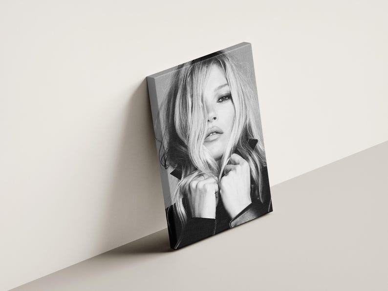 Vintage Kate Moss canvas poster featuring her iconic pose. A perfect addition to any 90s fashion lovers decor, black and white photography style for a retro, chic vibe. Ideal for celebrity wall art enthusiasts and retro home decor. Vintage Fashion