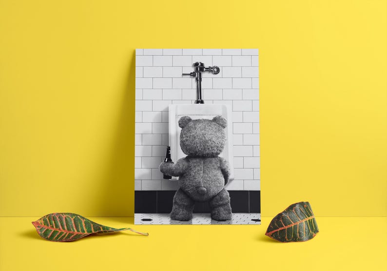 Playful bathroom decor print with a bear character standing at a urinal in a modern interior.