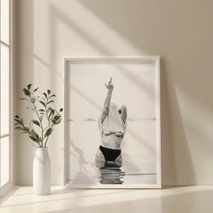 Striking black and white photography print featuring rebellious feminine energy. A bold and edgy feminist art piece, perfect for modern wall decor. Unique aesthetic gift for her, ideal for home, bedroom, or office. High-quality minimalist artwork for those who embrace fearless expression.