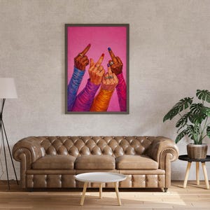 Female empowerment wall art with raised hands and vibrant nail polish