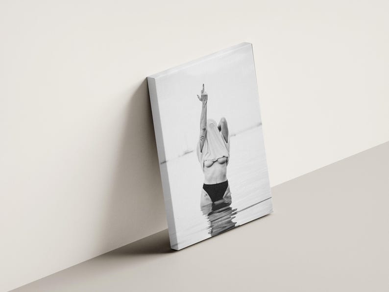 Striking black and white photography print featuring rebellious feminine energy. A bold and edgy feminist art piece, perfect for modern wall decor. Unique aesthetic gift for her, ideal for home, bedroom, or office. High-quality minimalist artwork for those who embrace fearless expression.