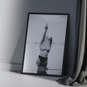Striking black and white photography print featuring rebellious feminine energy. A bold and edgy feminist art piece, perfect for modern wall decor. Unique aesthetic gift for her, ideal for home, bedroom, or office. High-quality minimalist artwork for those who embrace fearless expression.