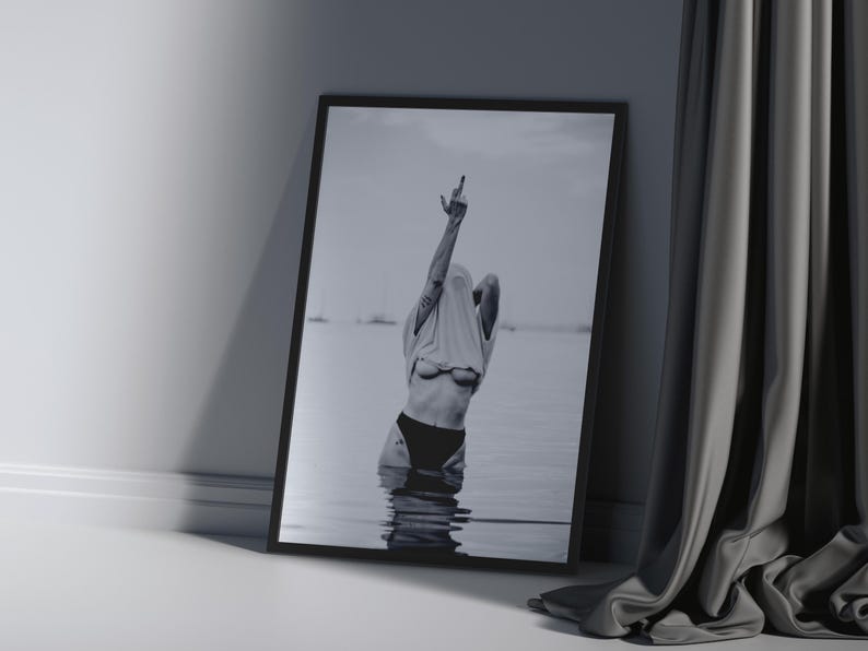 Striking black and white photography print featuring rebellious feminine energy. A bold and edgy feminist art piece, perfect for modern wall decor. Unique aesthetic gift for her, ideal for home, bedroom, or office. High-quality minimalist artwork for those who embrace fearless expression.