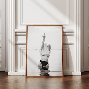 Striking black and white photography print featuring rebellious feminine energy. A bold and edgy feminist art piece, perfect for modern wall decor. Unique aesthetic gift for her, ideal for home, bedroom, or office. High-quality minimalist artwork for those who embrace fearless expression.