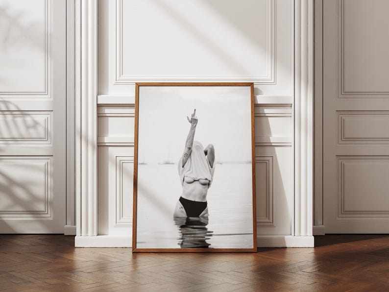 Striking black and white photography print featuring rebellious feminine energy. A bold and edgy feminist art piece, perfect for modern wall decor. Unique aesthetic gift for her, ideal for home, bedroom, or office. High-quality minimalist artwork for those who embrace fearless expression.