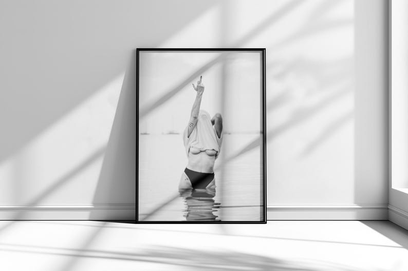 Striking black and white photography print featuring rebellious feminine energy. A bold and edgy feminist art piece, perfect for modern wall decor. Unique aesthetic gift for her, ideal for home, bedroom, or office. High-quality minimalist artwork for those who embrace fearless expression.