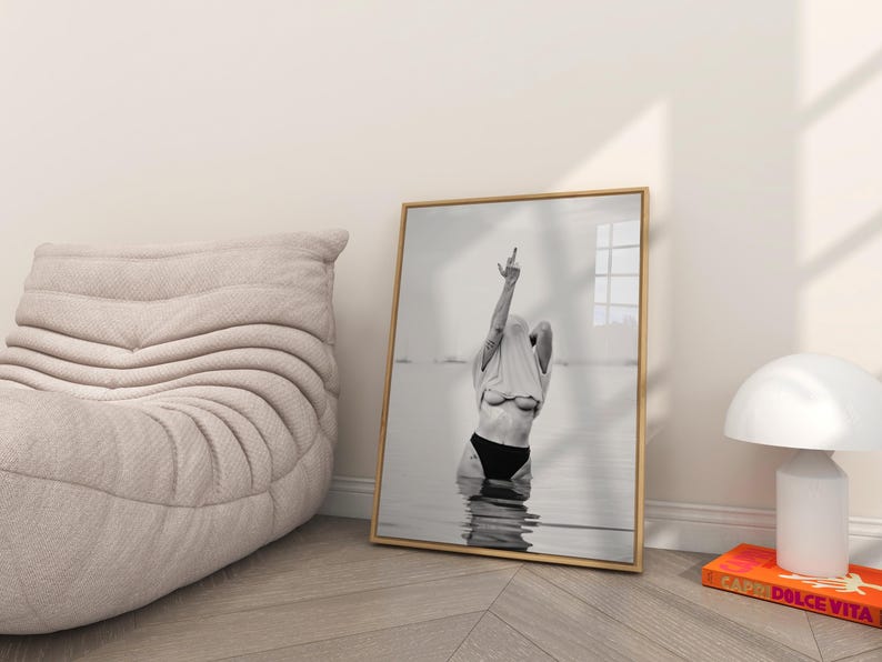 Striking black and white photography print featuring rebellious feminine energy. A bold and edgy feminist art piece, perfect for modern wall decor. Unique aesthetic gift for her, ideal for home, bedroom, or office. High-quality minimalist artwork for those who embrace fearless expression.