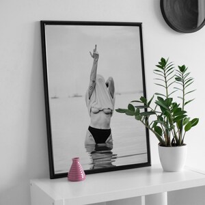 Striking black and white photography print featuring rebellious feminine energy. A bold and edgy feminist art piece, perfect for modern wall decor. Unique aesthetic gift for her, ideal for home, bedroom, or office. High-quality minimalist artwork for those who embrace fearless expression.