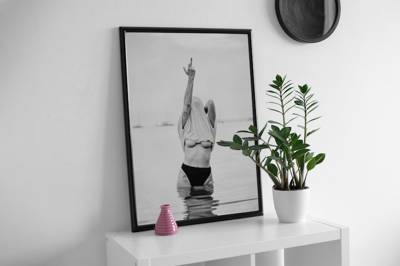 Striking black and white photography print featuring rebellious feminine energy. A bold and edgy feminist art piece, perfect for modern wall decor. Unique aesthetic gift for her, ideal for home, bedroom, or office. High-quality minimalist artwork for those who embrace fearless expression.