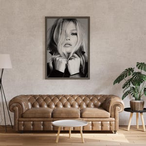 Vintage Kate Moss canvas poster featuring her iconic pose. A perfect addition to any 90s fashion lovers decor, black and white photography style for a retro, chic vibe. Ideal for celebrity wall art enthusiasts and retro home decor. Vintage Fashion