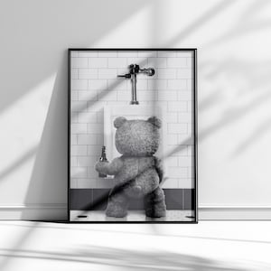 Funny bathroom photography print featuring a bear at a urinal with a bold black and white aesthetic.