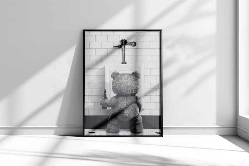 Funny bathroom photography print featuring a bear at a urinal with a bold black and white aesthetic.
