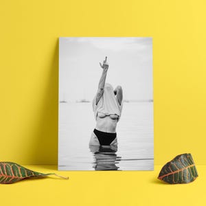 Striking black and white photography print featuring rebellious feminine energy. A bold and edgy feminist art piece, perfect for modern wall decor. Unique aesthetic gift for her, ideal for home, bedroom, or office. High-quality minimalist artwork for those who embrace fearless expression.
