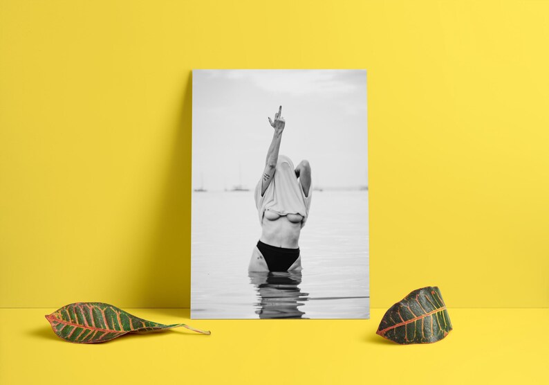 Striking black and white photography print featuring rebellious feminine energy. A bold and edgy feminist art piece, perfect for modern wall decor. Unique aesthetic gift for her, ideal for home, bedroom, or office. High-quality minimalist artwork for those who embrace fearless expression.