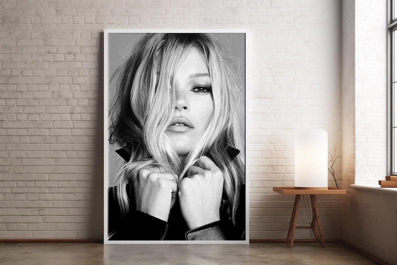 Vintage Kate Moss canvas poster featuring her iconic pose. A perfect addition to any 90s fashion lovers decor, black and white photography style for a retro, chic vibe. Ideal for celebrity wall art enthusiasts and retro home decor. Vintage Fashion