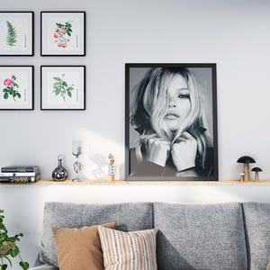 Vintage Kate Moss canvas poster featuring her iconic pose. A perfect addition to any 90s fashion lovers decor, black and white photography style for a retro, chic vibe. Ideal for celebrity wall art enthusiasts and retro home decor. Vintage Fashion
