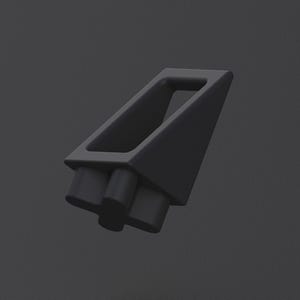 May include: A dark gray, geometric object with a triangular shape and a rectangular opening. Two cylindrical protrusions extend from the base. The object is set against a dark gray background.