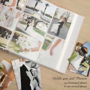 May include: A wedding photo album with a white cover and a striped spine. The album is open, displaying multiple 4x6 inch photographs of a wedding. The text on the image reads: "Holds 400 4x6" Photos, 240 horizontal photos & 160 vertical photos."