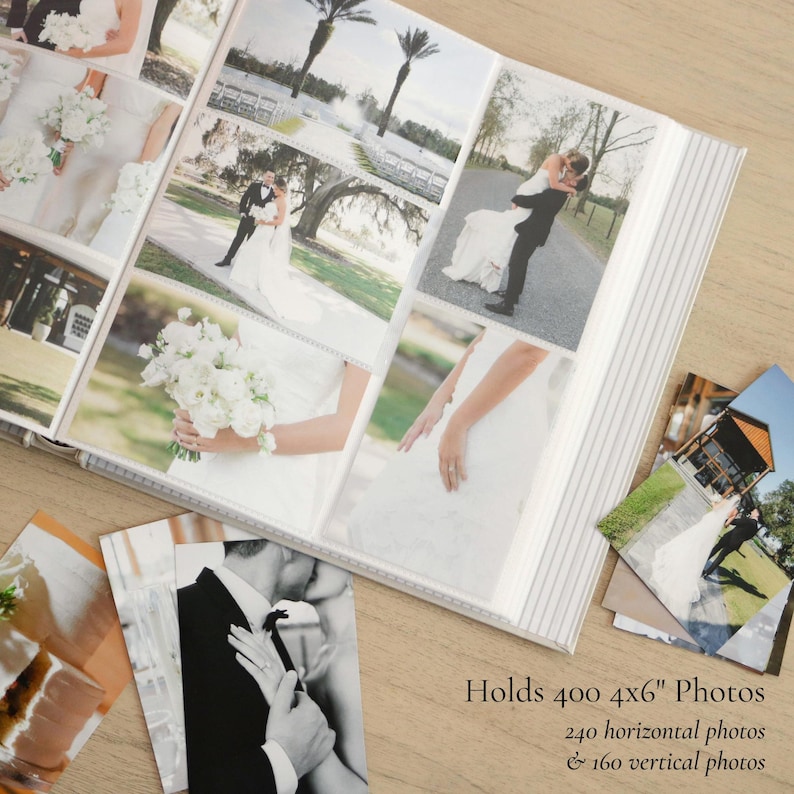 May include: A wedding photo album with a white cover and a striped spine. The album is open, displaying multiple 4x6 inch photographs of a wedding. The text on the image reads: "Holds 400 4x6" Photos, 240 horizontal photos & 160 vertical photos."