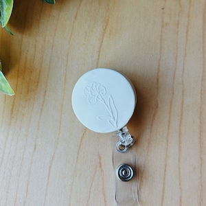 The Birth Flower Badge Reel: Handmade & Customizable Clay Badge Reel