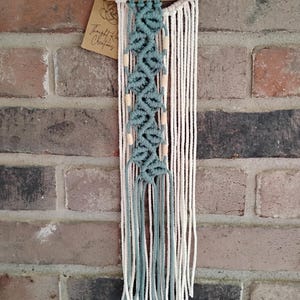 Small vine and leaf with wooden beads macrame wall hanging on driftwood