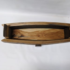 May include: A wooden box made from reclaimed oak barrel staves. The box has a natural wood finish and is open, revealing the interior.