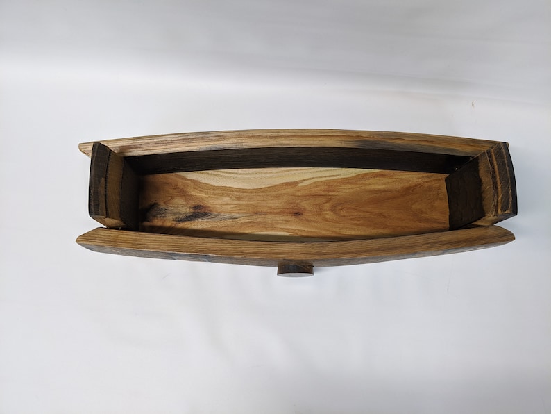 May include: A wooden box made from reclaimed oak barrel staves. The box has a natural wood finish and is open, revealing the interior.