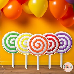 May include: Five colourful lollipop photo booth props with white sticks. The lollipops are green, yellow, orange, red, and purple. The lollipops are on a wooden floor in front of a yellow wall.