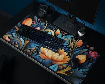 May include: A colorful floral mousepad with a keyboard and a mouse on top. The mousepad features a vibrant floral design with shades of blue, yellow, and pink.