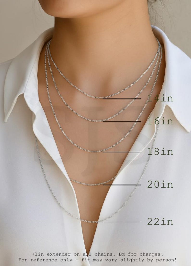 a close-up of a person's neck with multiple silver chain necklaces of varying lengths, ranging from 14 to 22 inches.