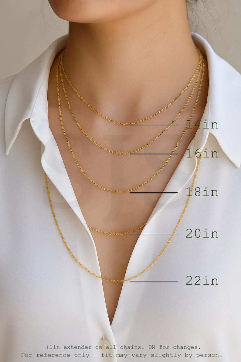a close-up of a person's neck with multiple gold chain necklaces of varying lengths, ranging from 14in to 22in.