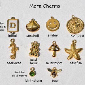 a bunch of charms that are on a piece of paper