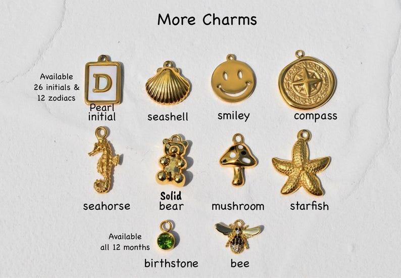 a bunch of charms that are on a piece of paper