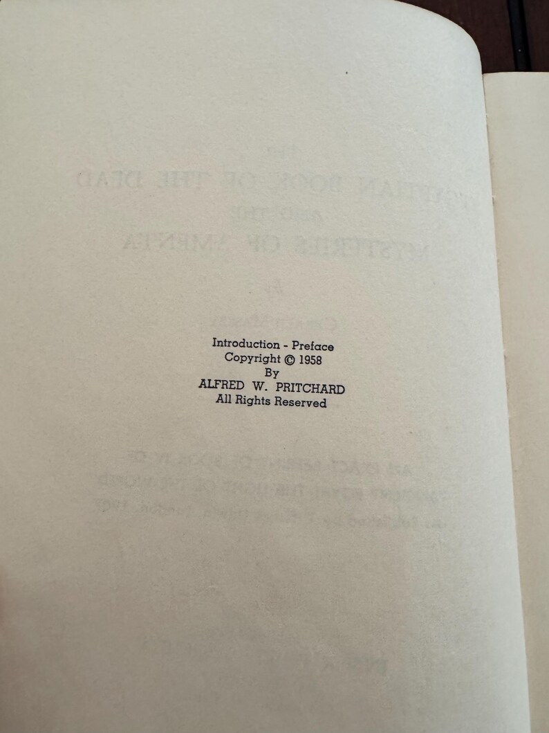 May include: An open book page with text from the book "Mysteries of the Dead". The text includes "Introduction - Preface", copyright information from 1958, and the author's name, Alfred W. Pritchard.