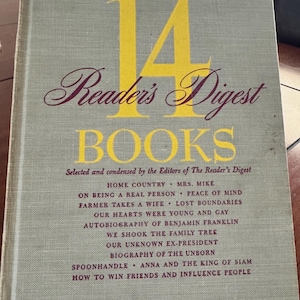 May include: Vintage "Reader's Digest Books" hardcover book. The cover is a light gray with the number "14" in yellow and the title in burgundy script. The book lists several condensed stories.