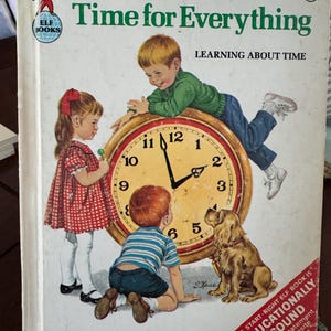 May include: Vintage children's book titled "Time for Everything" with illustrations of children and a dog interacting with a large clock. The cover features the text "Learning About Time" and the publisher's name.